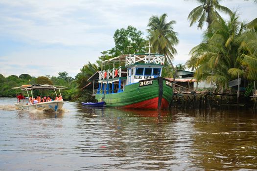 SABAH, MY - JUNE 20: Klias River and boat on June 20, 2016 in Sabah, Malaysia. Klias river is a Mangrove Forest Reserve and a ecotourism destination wherein you can see proboscis monkey in the trees.