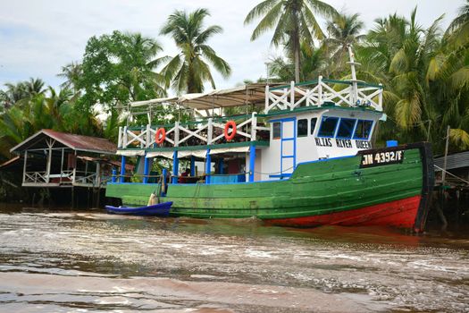 SABAH, MY - JUNE 20: Klias River and boat on June 20, 2016 in Sabah, Malaysia. Klias river is a Mangrove Forest Reserve and a ecotourism destination wherein you can see proboscis monkey in the trees.