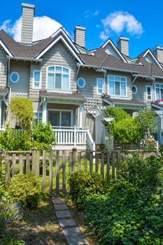 Residential townhouses on sunny day in Vancouver, British Columbia, Canada