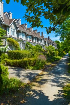 Residential townhouses on sunny day in Vancouver, British Columbia, Canada