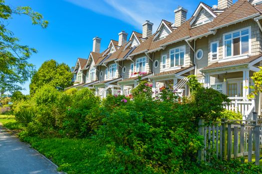 Residential townhouses on sunny day in Vancouver, British Columbia, Canada