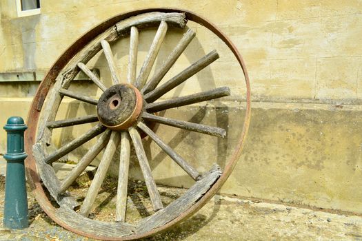 Old broken wooden wheel