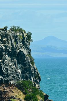 Geologically young coastlines of New Zealand; erosion and sedimentation of cliffs revealing structure and texture of weathered rocks.