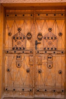 Handmade doors carved with the traditional Arab ornament, Ushaiqer Heritage Village, Saudi Arabia
