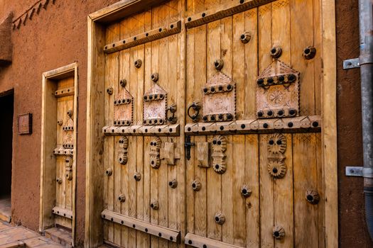 Handmade doors carved with the traditional Arab ornament, Ushaiqer Heritage Village, Saudi Arabia