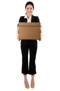 A young woman carrying a box