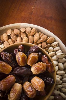 Set of nuts and dried fruits on a wooden table