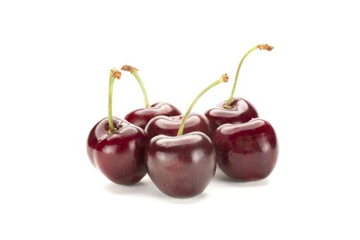 A bunch of ripe red cherries. Isolated on white background.