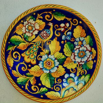 Decorative porcelain plates, cheerful and  brightly coloured
