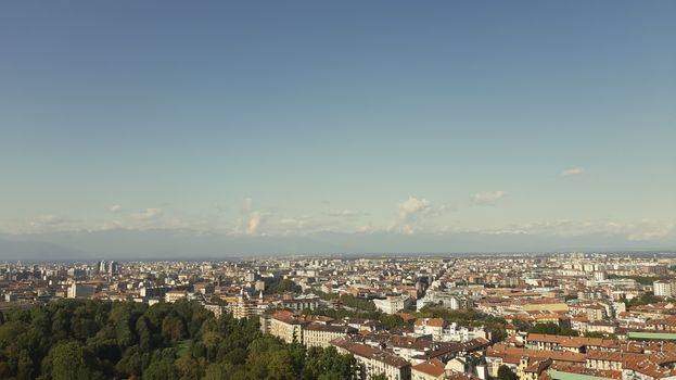 Turin, Italy - 07/02/2020: Travelling around North Italy. Beautiful caption of Turin wih sunny days and blue sky. Panoramic view to the city from Mole Antoneliana. Detailed photography of the old part