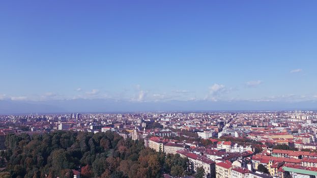 Turin, Italy - 07/02/2020: Travelling around North Italy. Beautiful caption of Turin wih sunny days and blue sky. Panoramic view to the city from Mole Antoneliana. Detailed photography of the old part