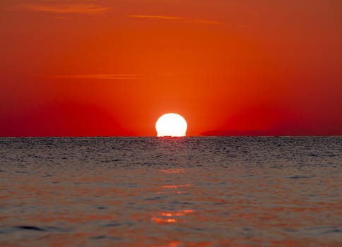 big sun down over sea sunrise, red sky