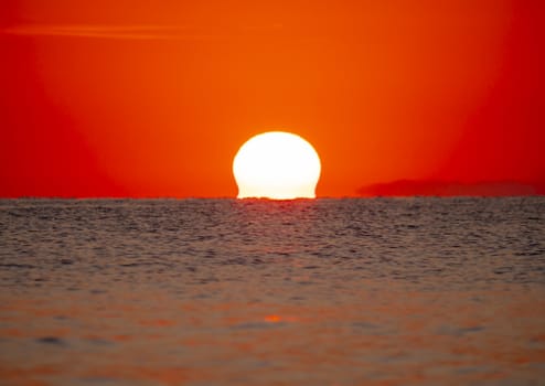 big sun down over sea sunrise, red sky