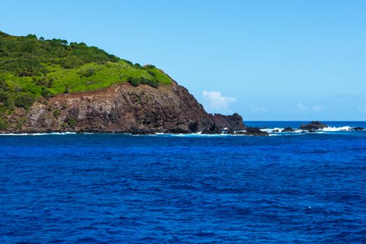 A tip of Pitcairn Island, the home of the descendants of the Mutiny on the Bounty, juts out to sea.