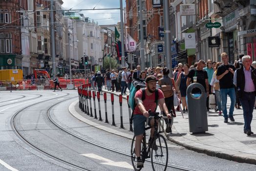 Dublin, Ireland--July 16, 2018. Dublin's streets are busy with pedestrians and cyclists.