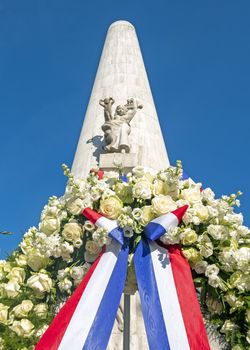 Amsterdam, Netherlands - May 5, 2020: Wreath from King Willem Alexander and Queen Maxima from the Netherlands at the National Monument on occasion of remembrance of the worldwar II  in Amsterdam the Netherlands