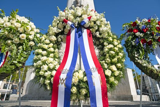 Amsterdam, Netherlands - May 5, 2020: Wreaths at the National Monument on the occasion of remembrance of the worldwar II in Amsterdam the Netherlands 