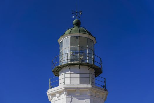 Day view of lighthouse Armenistis manufactured in 1891 on the north-western tip of Mykonos, Greece.