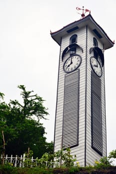 KOTA KINABALU, MY - JUNE 21: Atkinson clock tower on June 21, 2016 in Kota Kinabalu, Malaysia. Atkinson Clock Tower is the oldest standing structure in Kota Kinabalu. It sits in solitary along Signal Hill Road.