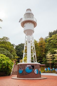 Fort Canning Lighthouse in Fort Canning Park in Singapore City on a warm humid morning.