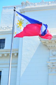 Manila, PH - JULY 6: National flag of the Philippines in Rizal Park on July 6, 2016. The Philippine flag is a horizontal flag bicolor with equal bands of royal blue and scarlet, and a white triangle.