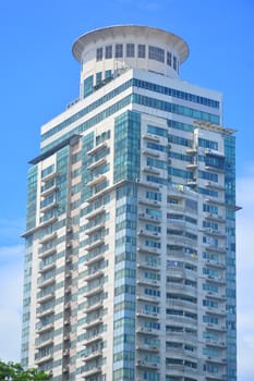 MANILA, PH - JULY 6: Tall building surrounding Rizal park on July 6, 2016 in Manila, Philippines.