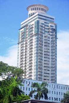 MANILA, PH - JULY 6: Tall building surrounding Rizal park on July 6, 2016 in Manila, Philippines.