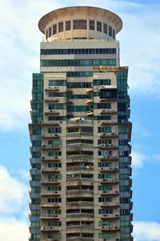 MANILA, PH - JULY 6: Tall building surrounding Rizal park on July 6, 2016 in Manila, Philippines.
