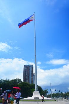 Manila, PH - JULY 6: National flag pole of the Philippines in Rizal Park on July 6, 2016. The Philippine flag is a horizontal flag bicolor with equal bands of royal blue and scarlet, and a white triangle.