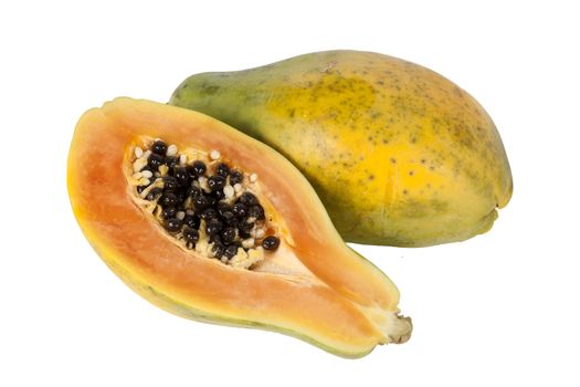 Raw organic papaya fruit sliced in half which have many antioxidant food nutrition health benefits cut out and isolated on a white background