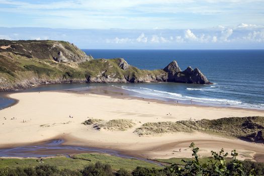 Three Cliffs Bay beach on the Gower Peninsular West Glamorgan Wales UK, which is a popular Welsh coastline travel destination of outstanding beauty