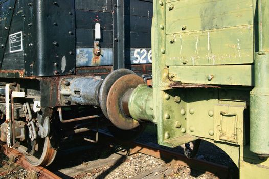 Old fashioned rusty railway freight train coupling buffers stock photo