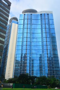 TAGUIG, PH- OCT. 1: Skyscraper building facade on October 1, 2016 in Bonifacio Global City, Taguig, Philippines. Bonifacio Global City is a financial district in Metro Manila, Philippines
