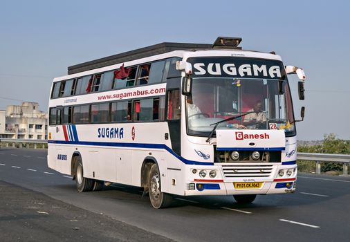 Pune, Maharashtra, India- October 25th, 2016: Sugama travels bus speeding on highway.