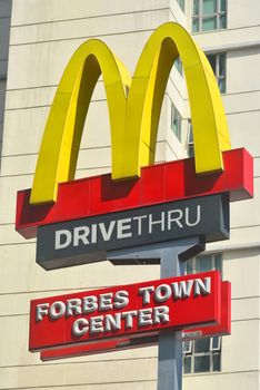 TAGUIG, PH - OCT. 1: McDonald's Forbes Town Center signage on October 1, 2016 in Forbes Town Center, Taguig City, Philippines. McDonald's is an American hamburger and fast food restaurant chain. It was founded in 1940.