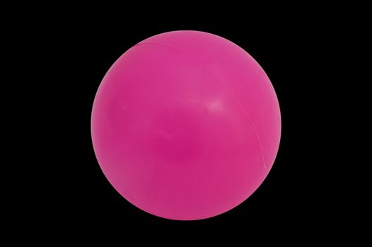 Pink round plastic ball cut out on and isolated on a black background