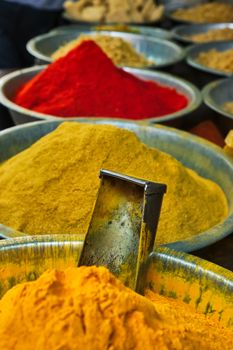 Turmeric curcuma powder and chili powder in spices market in India. Sardar Market, Jodhpur, Rajasthan, India