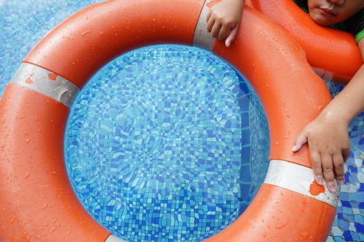 Safety equipment, life buoys, or rescue red buoys in the pool to help people from drowning.