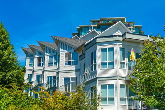 Top of luxury apartment building with green trees surround