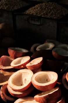 Coconuts in vegetable market in street lit by sun. Sardar Market, Jodhpur, Rajasthan, India