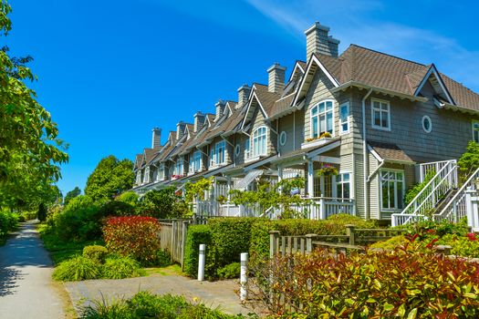 Residential townhouses on sunny day in Vancouver, British Columbia, Canada