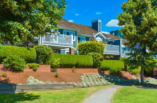 Beautiful attached houses on blue sky background in British Columbia, Canada