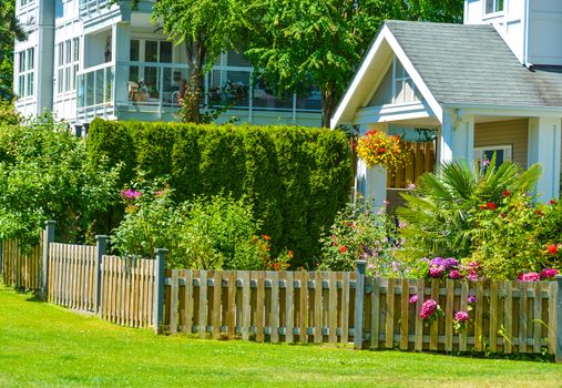 Entrance of residential apartment building on bright sunny day in Vancouver, British Columbia