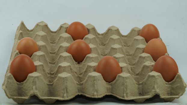 The chicken eggs in the farmer's produce panel are spaced between the eggs.