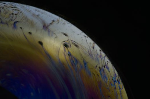 Structure texture soap bubble abstract black background.