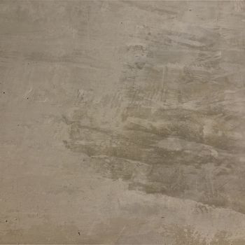 The gray cement background wall has a pattern made of cement plaster.