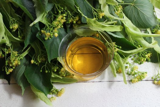 The picture shows lime blossom tea on white boards