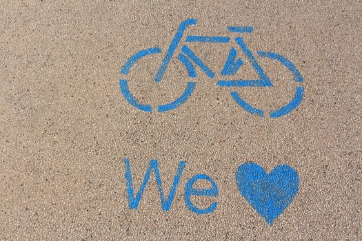 Blue marked bike path on Lake Garda in Italy.