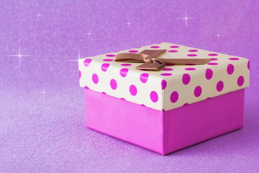 Colorful gift box on pink background, christmas, happy new year, birthday, valentine concept