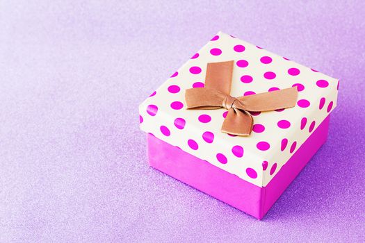 Colorful gift box on pink background, christmas, happy new year, birthday, valentine concept